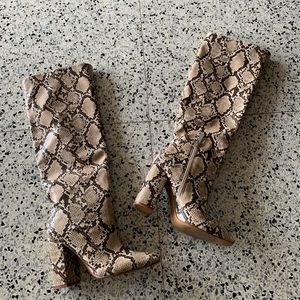 snakeskin knee high heeled boots